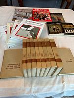 Overview of all books arranged on table showing titles and spines.