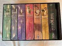 Box set of Highlander TV series DVD seasons 1-6 and Highlander: The Raven in slipcase box showing spines of cases.