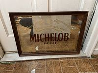 Front view of Michelob Beer mirror with Anheuser-Busch gold printed logo and framed in wood.