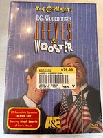 Front box cover of the complete 8 DVD set for P.G. Wodehouse’s Jeeves & Wooster showing title, episode count, starring Hugh Laurie, and A&E logo.