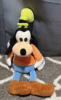 Front view of the plush Goofy toy showing all major details including colors and fabric.