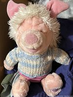 Clear front-facing photo of the vintage Disney Piglet plush toy showing detailed facial features, sweater, and body condition.