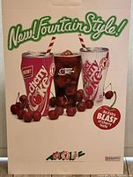 Full view of the vintage Coca-Cola Cherry Coke advertisement poster with product images and branded text.