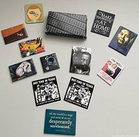 Overview of vintage electronic data bank calculator and 11 assorted decorative magnets with various art and quotes