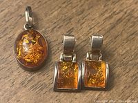 Sterling silver pendant and rectangular amber stone earrings set