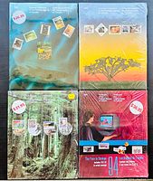 Four unopened Canada Post souvenir postage stamp collections from 1991 to 1994, shrink-wrapped with visible price stickers on covers.