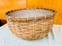 Wicker planter basket with reinforced rim and woven construction