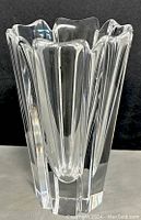 Front view of clear crystal Orrefors Corona vase showing fluted design and thickness.