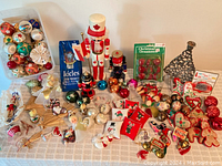 Wide shot of assorted vintage and antique Christmas decorations on table