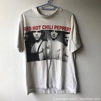 Front view of vintage Red Hot Chili Peppers t-shirt showing band photo and text