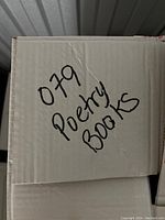 Photo of box labeled 'Poetry Books 079' indicating the content is poetry books.