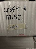 Photo of a cardboard box labeled 'craft & misc' containing the lot items.