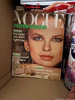 Photo of Vogue magazine cover with a female model and headline 'new ease'