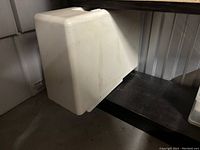 White plastic hard carrying case for Kenmore sewing machine, showing minor marks and wear