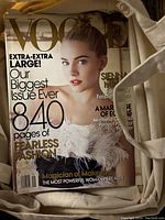 Vogue magazine September issue with a female model wearing feathered attire on the cover inside tote bag