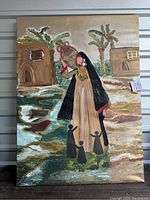 Photo of a 36x48 inch painting depicting a mother in traditional Middle Eastern dress holding a child with three smaller children around her in a rural village scene.