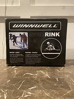 Winnwell QuikRink box front showing product name and photo of people ice skating.