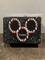 Front view of the closed product box labeled Knonew with a festive light motif