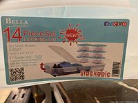 Label showing Bella 14 Piece Set with locking lid and stackable feature, container dimensions and quantities.