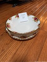 Stack of two Royal Albert Old Country Roses cake plates showing floral rose pattern and gold trim