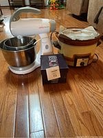 Photo showing Sunbeam Mixmaster, Canadian General Electric slow cooker, and boxed Gourmet du Village dip chiller together