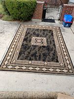 Full view of southwestern style rug laid out flat showing overall design and size.