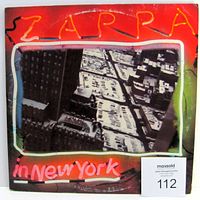 Front cover of the double LP vinyl album showing the colorful artwork and title