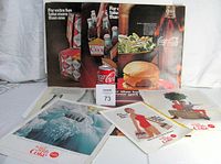 Overview of eight vintage Coca Cola magazine ads from the 1960s, laid out showing various colorful graphics, slogans, and Coca Cola imagery