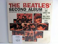 Front of the sealed Beatles' Second Album in original sleeve with slight corner damage on bottom edges.