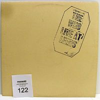 Front cover of The Who Live At Leeds album, beige with black stamped logo.