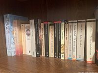 Bookshelf with 17 books related to Jane Austen, Brontë sisters, Susanna Moodie and other classic literature authors.