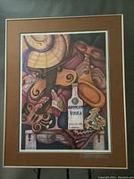 Full view of the framed art showing the Absolut Vodka bottle and southwestern-themed elements in warm earthy colors.