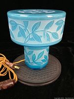 Full view of lamp assembled showing base, shade and cord