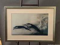 Full view of the framed artwork featuring the woman and dogs by Louis Icart.