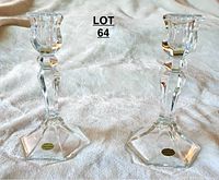Pair of clear glass/crystal candlesticks with hexagonal bases and gold 'Made in France by Tulipier' labels.