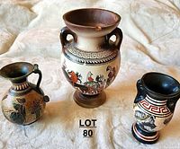 Photo showing all three vases from above on neutral background, highlighting size differences and decoration