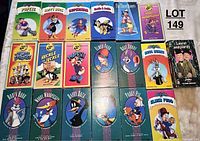Photo of assorted cartoon VHS tapes including Popeye, Superman, Looney Tunes and Laurel and Hardy