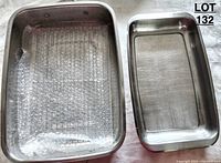 Two stainless steel rectangular pans with one lined with bubble wrap