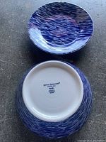 Blue bowl with dense streak pattern visible, includes the bottom showing brand Royal Doulton Pacific marking.