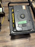 Top view showing fuel tank cap and output rating label