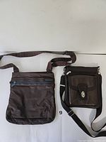 Two brown shoulder bags side by side showing overall size and shape differences