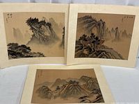 Three Japanese silk paintings mounted on paper, showing full view of all artworks side by side