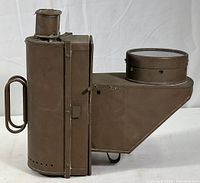 Side view showing the brass body, handle, and fuel container section.