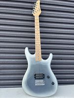 Full front view of Viper electric guitar leaning against corrugated metal background