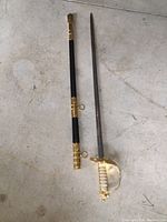 Sword and scabbard laid flat showing full length