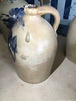 Full view of jug front showing cobalt floral decoration and overall shape