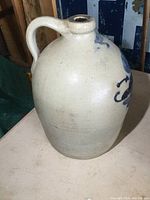 Full view of jug showing body shape and handle