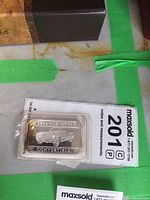 Front view of the silver bar showing the 1954 Corvette Convertible car engraving, including year and model text.