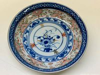 Top view showing the colorful floral and traditional pattern on the porcelain plate