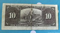 Back side of 1937 Bank of Canada $10 bill featuring classical artwork and denomination.